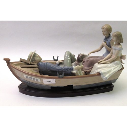 599 - Large Lladro group of figures in an open boat (damaged), 38cm long