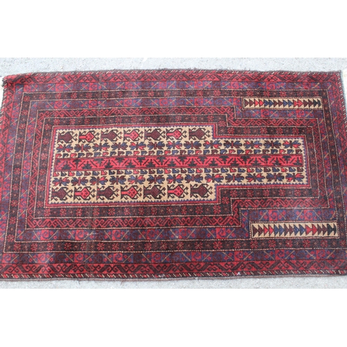 6 - Belouch prayer rug with a stylised design on a beige ground with multiple borders, 132 x 80cm