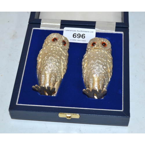 696 - Cased pair of Mappin & Webb cast silver condiments in the form of owls, 6.5oz t