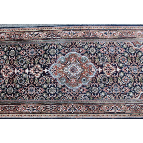 7 - Indian Persian pattern runner with three central medallions and multiple borders, 360cm x 75cm