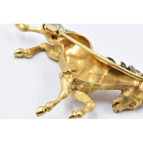 738 - 18ct Yellow and white gold diamond chip set brooch in the form of a galloping horse, 17g