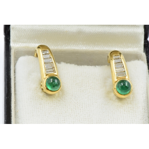 749 - Pair of modern cabochon emerald and baguette diamond set yellow metal ear clips in box