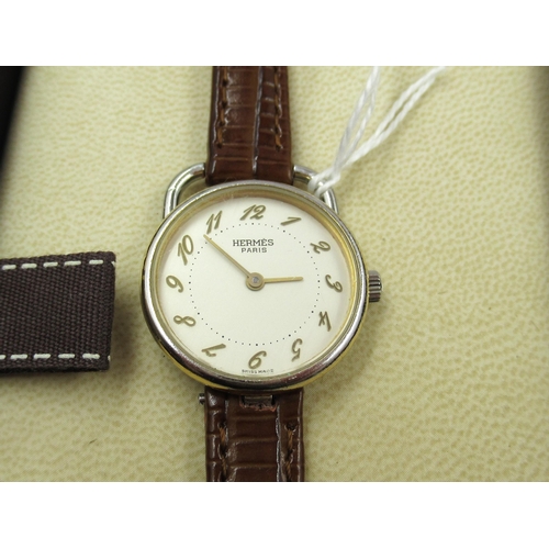 762 - Hermes, Paris, ladies gold plated quartz wristwatch with leather strap, in original box