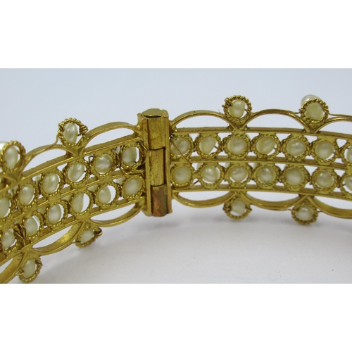 788 - Middle Eastern yellow metal and pearl bangle, 21.5g