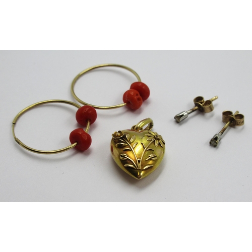 794 - 15ct Gold heart shaped pendant, pair of 9ct gold coral set earrings and a pair of small stud earring... 