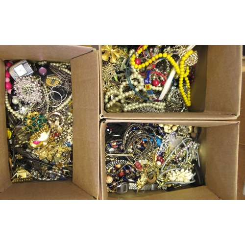 855 - Three boxes containing a quantity of various costume jewellery