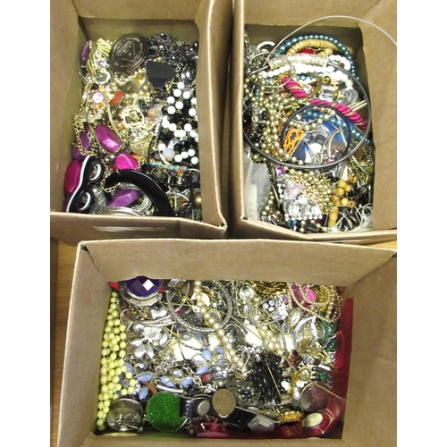 857 - Three boxes containing a collection of various costume jewellery