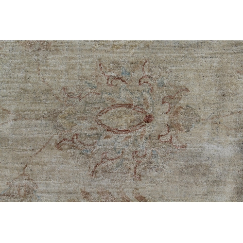 9 - Chobi carpet of floral design with multiple borders on beige ground, 370cm x 278cm