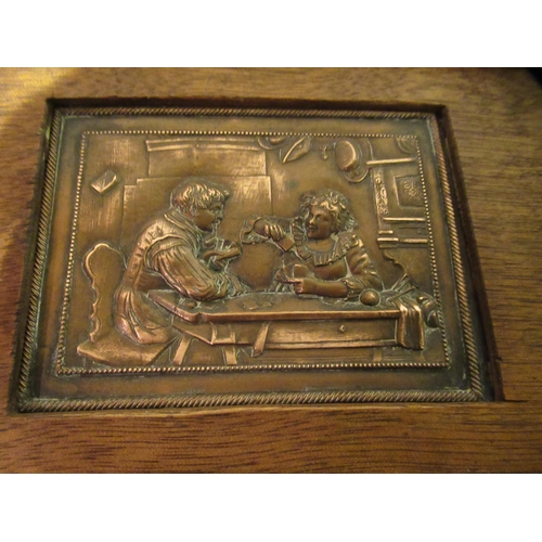 96 - Small rectangular embossed copper plaque, figures in an interior, oak framed, 8 x 10cm