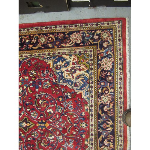 16 - Modern Kashan rug, with all-over floral design on red ground with borders