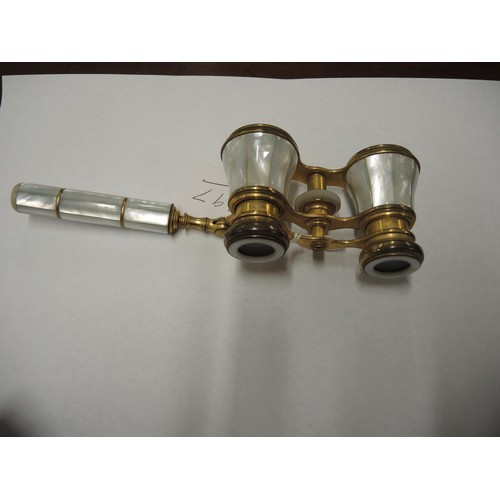 297 - Pair of gilt brass mother of pearl mounted opera glasses with telescopic handle and leather case