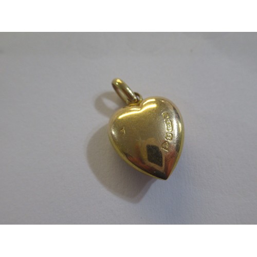 794 - 15ct Gold heart shaped pendant, pair of 9ct gold coral set earrings and a pair of small stud earring... 