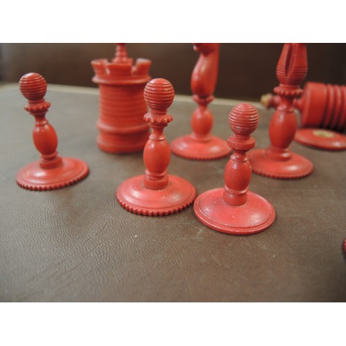 108 - 19th Century carved bone natural and red stained chess set, in later box