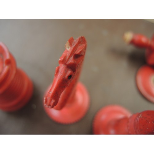 108 - 19th Century carved bone natural and red stained chess set, in later box