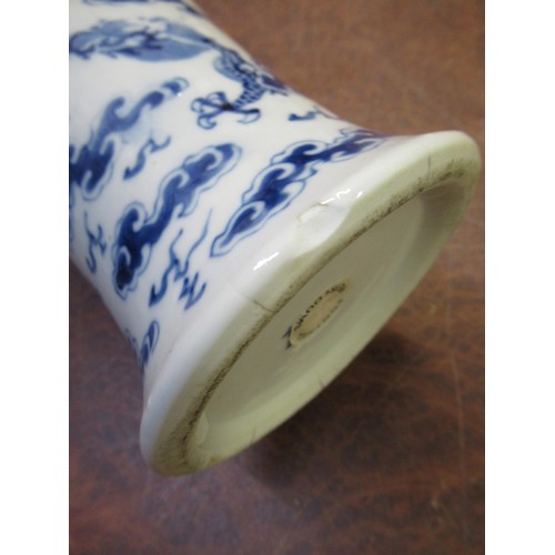 489 - Chinese baluster form vase with cover, blue and white decorated with dragons, 35cm high, together wi... 