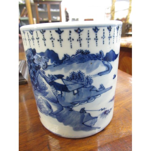 511 - Chinese ceramic brush pot, blue and white decorated with a river landscape, 14cm high, 13cm diameter