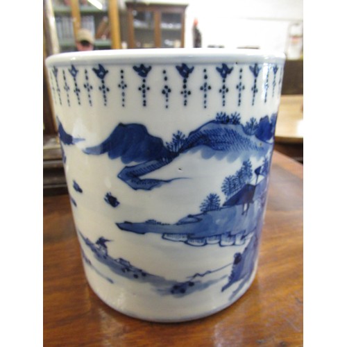 511 - Chinese ceramic brush pot, blue and white decorated with a river landscape, 14cm high, 13cm diameter