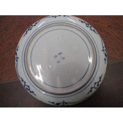 570 - Japanese circular charger blue and white decorated with bamboo and flowers, 31cm diameter, together ... 