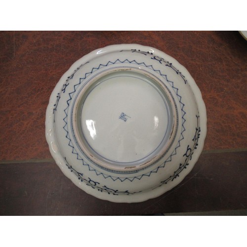 570 - Japanese circular charger blue and white decorated with bamboo and flowers, 31cm diameter, together ... 