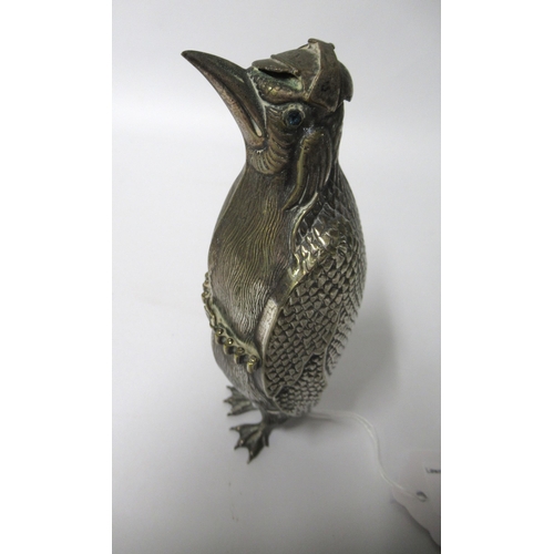 274 - Unusual silver plated German figure of a penguin holding a rifle with jewel inset eyes, circa 1900, ... 