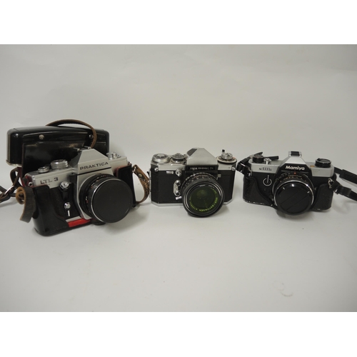 316 - Group of three 35mm SLR cameras, including Edixa Prismatic