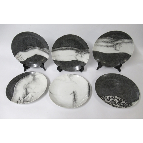 556 - Fornasetti Milano set of twelve Adamo printed wall plates, 25cm diameter