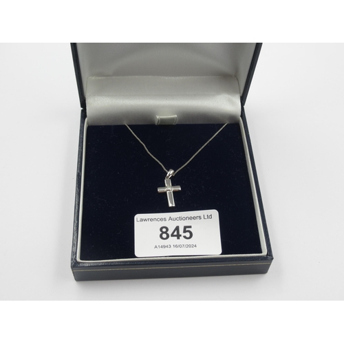 845 - 9ct White gold crucifix pendant set with a diamond, with fine link chain, 1.7gms