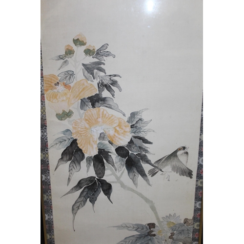 885 - Oriental watercolour on linen, bird and flowers, 116 x 30cm and a straw work picture of peacocks, wi... 