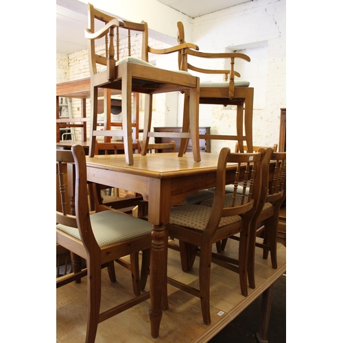 1205 - Modern pine rectangular extending dining table on turned supports, together with a set of eight (six... 