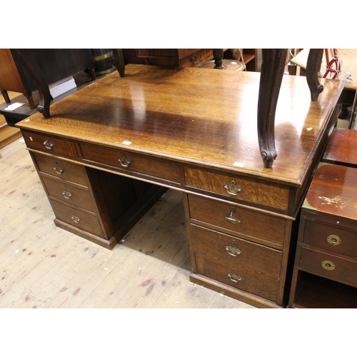 1211 - Early to mid 20th Century oak twin pedestal partners desk, the moulded top above an arrangement of v... 