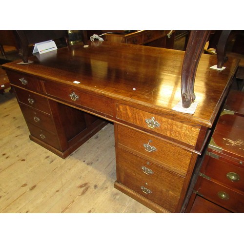 1211 - Early to mid 20th Century oak twin pedestal partners desk, the moulded top above an arrangement of v... 