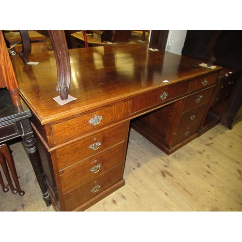 1211 - Early to mid 20th Century oak twin pedestal partners desk, the moulded top above an arrangement of v... 