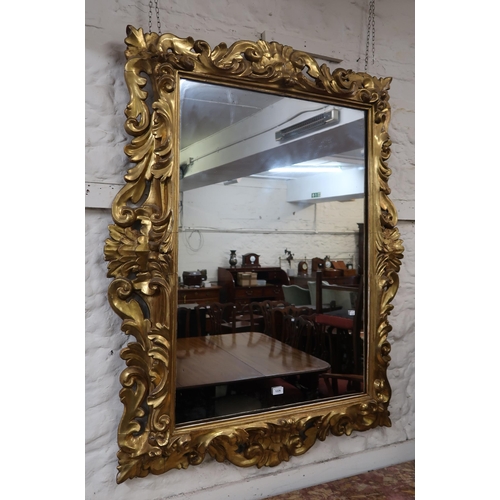 1226 - Large and fine quality 18th / 19th Century Florentine carved and gilded wall mirror, the deeply carv... 