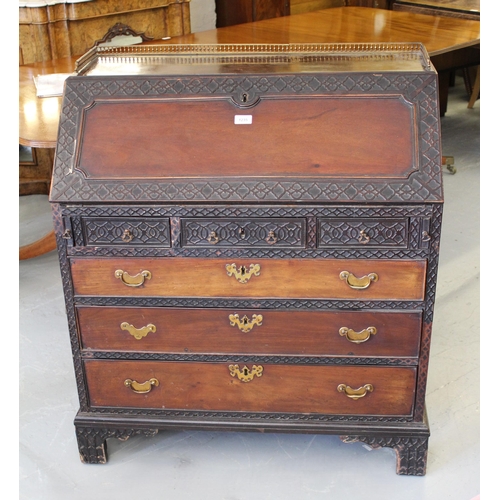 1235 - 19th Century mahogany bureau, the fall front and upper drawers with blind fretwork and conforming fi... 