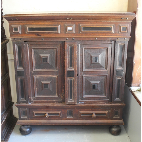 1357 - 18th Century Flemish oak side cabinet with a pair of geometric panel moulded doors above a long draw... 