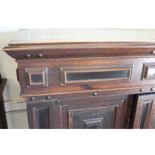 1357 - 18th Century Flemish oak side cabinet with a pair of geometric panel moulded doors above a long draw... 