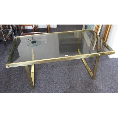 1386 - Mid 20th Century rectangular smoke glass coffee table on a gilt metal base, 130 x 70cm