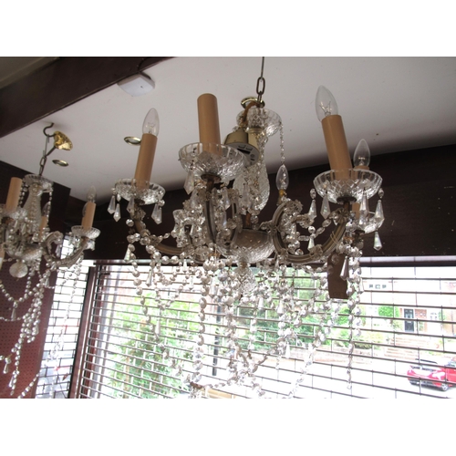 1397 - Pair of 20th Century brass six branch chandeliers with glass drops, 43cm high