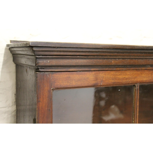 1399 - George III mahogany and oak dwarf breakfront bookcase having glazed doors on a plinth base, 310cm wi... 