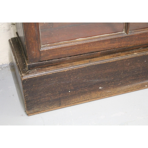 1399 - George III mahogany and oak dwarf breakfront bookcase having glazed doors on a plinth base, 310cm wi... 