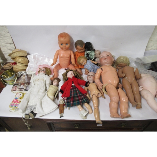 100 - Large box containing a quantity of various dolls, dolls clothes and other related collectables