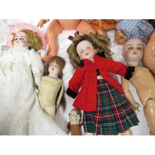 100 - Large box containing a quantity of various dolls, dolls clothes and other related collectables