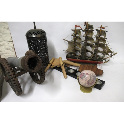 114 - Quantity of miscellaneous items, including a metal model of a cannon, world globe, model boat etc.