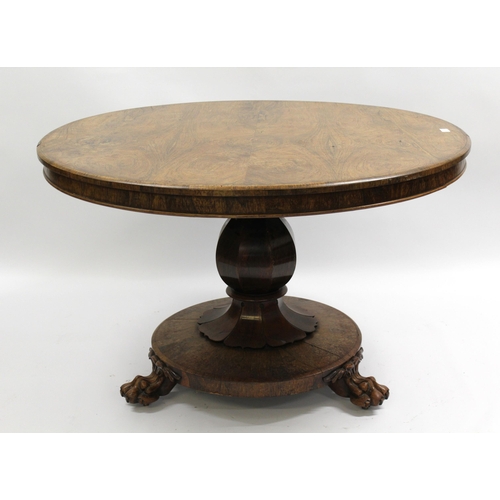 1684 - 19th Century rosewood circular loo table on an octagonal baluster column, with circular base and paw... 