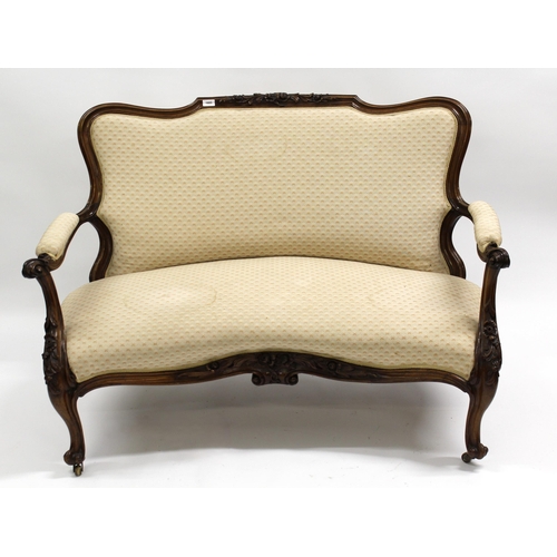 1685 - 19th Century floral carved rosewood and beige upholstered two seat sofa, having cabriole front suppo... 