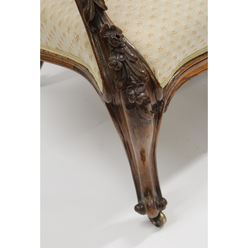 1685 - 19th Century floral carved rosewood and beige upholstered two seat sofa, having cabriole front suppo... 