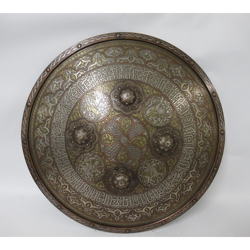 173 - Islamic Mumlok revival cast brass shield having inlaid silver and Arabic calligraphy decoration, dia... 