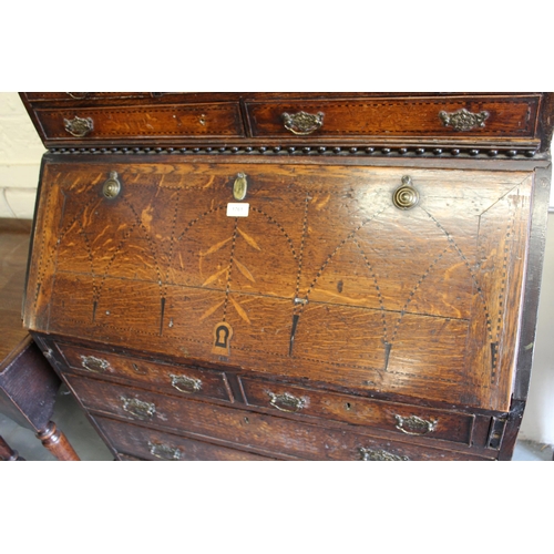 1761 - 19th Century oak inlaid bureau bookcase, having moulded top with arched top glazed doors, an arrange... 