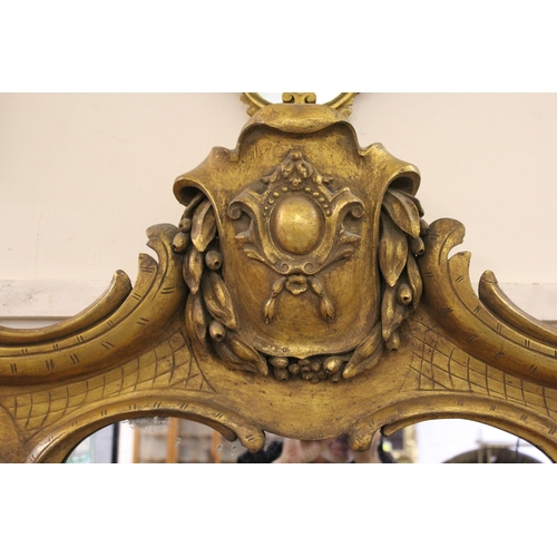 1763 - Large 19th Century gilt framed rococo style over-mantel mirror (re-gilded), 190cm high x 155cm wide