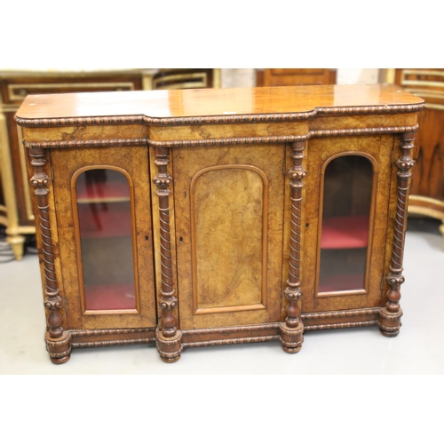 1795 - 19th Century walnut breakfront chiffonier, having central arched panel door flanked by two glazed ar... 